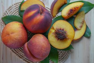 Yellow Peach with slice on wooden background. Fresh Yellow Peach.