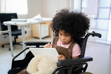 Kid with tablet and sitting on wheelchair. Health and wellness of a patient at hospital.