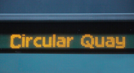 Yellow digital signage on a light rail train reading Circular Quay
