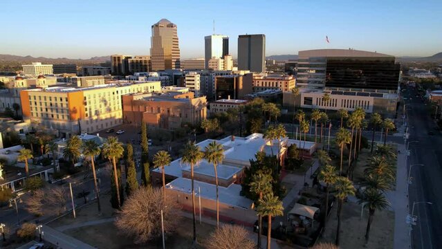 Aerial pullout at sunrise from Tucson Arizona Skyline over the Palms