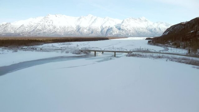 4k 30fps aerial video of the Knik River bridge.  Palmer, Alaska.  Winter