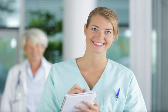 nice looking nurse with pen and paper