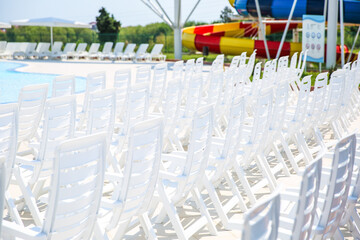 empty sun loungers in the resort on a sunny summer day