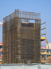 Rebars bars for concrete wall construction of a new building. Construction site. Iron structure...