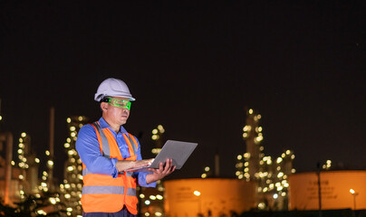 Engineer wearing uniform, white helmet standing hold detail laptop inspection work site progress...