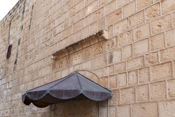 Religious stone carving above the rear entrance of The Greek Orthodox Church of the Annunciation in...