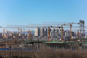 Intensive work of urban tower crane under construction