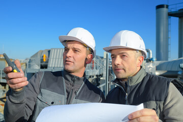 team of construction engineers looking at the site
