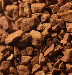 Instant coffee granules as background.