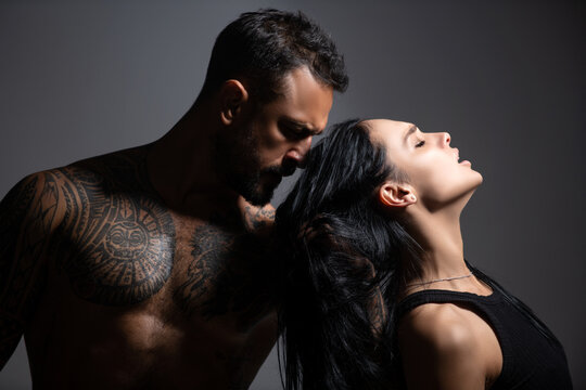 Lovely sexy couple in love. Man embrace sensual woman. Fashion and beauty, romantic guy and girl. Romantic couples embraces. Sexy elegant couple in the tender passion. Beautiful woman near the man.