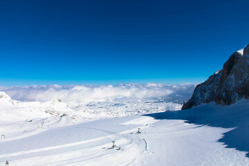 Panorama view from the Dachstein Glacier. The plateau is the best place for skiing, snowboarding and other winter sports, Styria, Austria. Tourism and vacations concept.Eternal ice in the Alps.