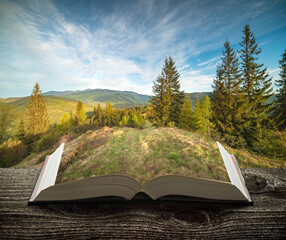 Mountain valley on the pages of book