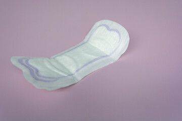 Woman hygiene protection. Sanitary pads on purple background top view.