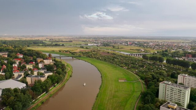 Opole, Oder Odra river railway bridge, Pasieka Island and Canal Ulgi. Drone aerial view in 4k UHD real time. Simple, plain straight forward flight.