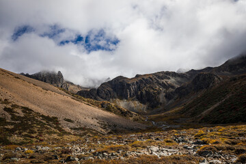 Mountain landscape view with rocky valley and cloudy sky