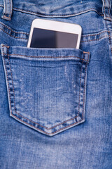 mobile phone in jeans pocket