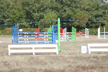 Obraz na płótnie Canvas Show jumping poles obstacles, barriers, waiting for riders