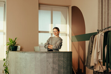 Small business owner working in her clothing store