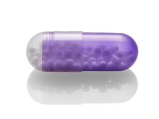 Purple capsule isolated on white background.