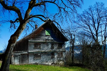Fototapeta na wymiar Abandoned wooden house in rural Austria. Bregenz, Vorarlberg.
