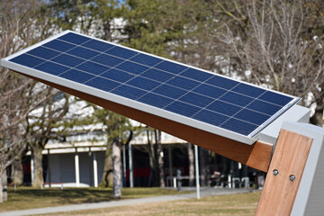 Outdoor bench with solar panels on top