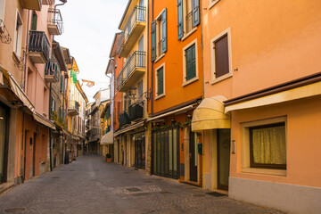 Fototapeta na wymiar A shopping street at Christmas in Garda town on the east shore of lake Garda, Verona Province, Veneto, north east Italy 