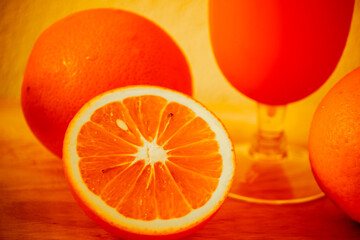 Orange cut in half, sweet and sour taste.