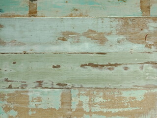 Texture of old vintage wood with peeling paint , light green color background .