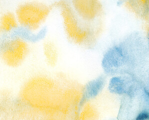 Abstract hand painted watercolor. Colorful splashes of yellow and blue on paper. This is a wet background texture with paint brushes. Picture for creative wallpaper or design work.
