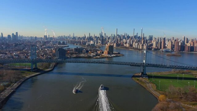 Hi-Speed Aerial Shot of the Hell Gate Bridge and the RFK Bridge