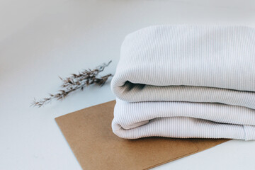 clothing fabric folded on a white background is beautiful, place, storage, lifestyle, background,