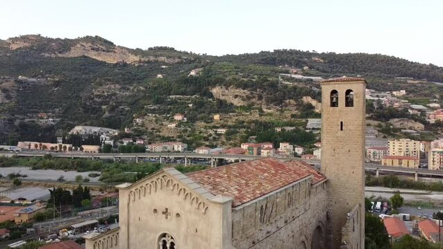 Aerial drone shot of a view of the church of San Michele Arcangelo in the medieval old town of Ventimiglia in Italy, Liguria, Italy. Beautiful panoramic aerial view vehicle of the Ligurian Riviera