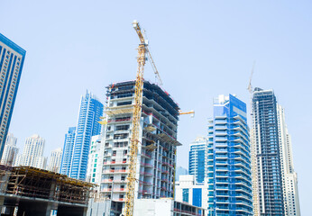 Fototapeta na wymiar modern buildings in construciton at Dubai city, UAE