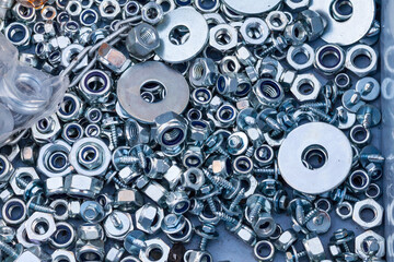 Background texture of assorted bolts and washers