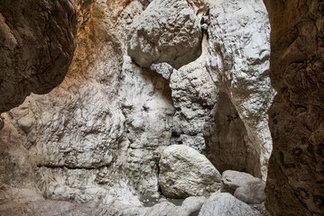 Fototapeta na wymiar Saklikent Canyon or “hidden city” in Turkish. Close-up of fragments of rocks of canyon. Saklikent National Park in Mugla province. Steep mesmerizing rocks. Wild natural beauty in sun.
