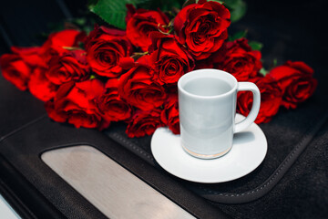 Flowers and cup of tea close up