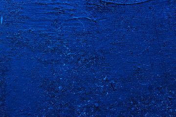 Blue embossed abstract texture background. White blotches of fine dust on a blue background.