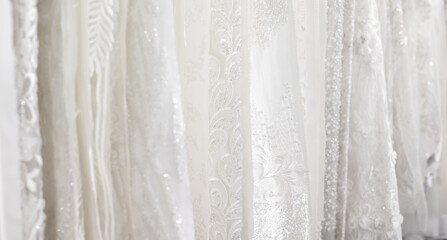 Luxury fabrics of light embroidered fabric for elegant wedding dresses. Rhinestones and beads, lurex.
