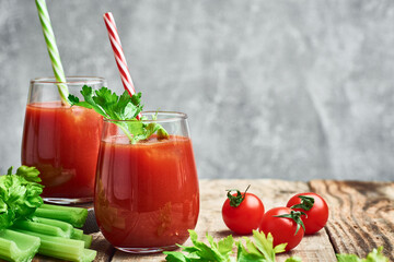 Tomato juice. Fresh red tomato celery detox juice in glass. Homemade tomato juice.