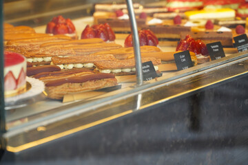 Tasty French pastry in a patisserie sweets shop from Paris. Quiches, croissants and other specific...