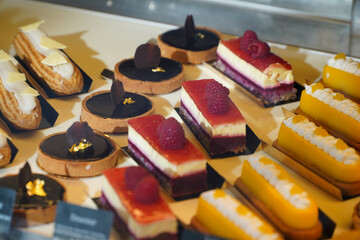 Tasty French pastry in a patisserie sweets shop from Paris. Quiches, croissants and other specific breakfast foods of France. photo inside.