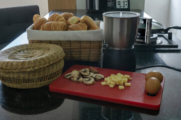 Delicious fresh puff pastry croissant eggs and chocolate for breakfast