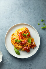 Spaghetti with tomato sauce and basil