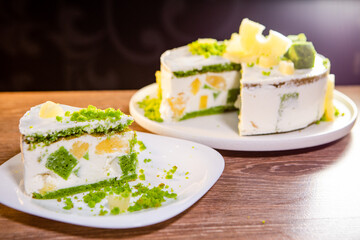 a piece of airy cake with citrus sponge and pineapple slices