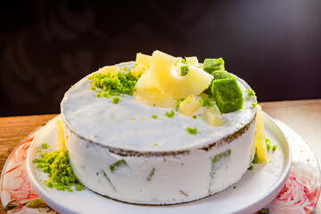cake with citrus sponge and pineapple slices