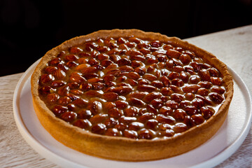 caramel pistachio tart on a white plate