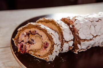 meringue chocolate roll with berries