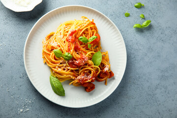 Spaghetti with tomato sauce and basil
