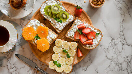 Top view, Fresh fruits with soft cheese on wooden board
