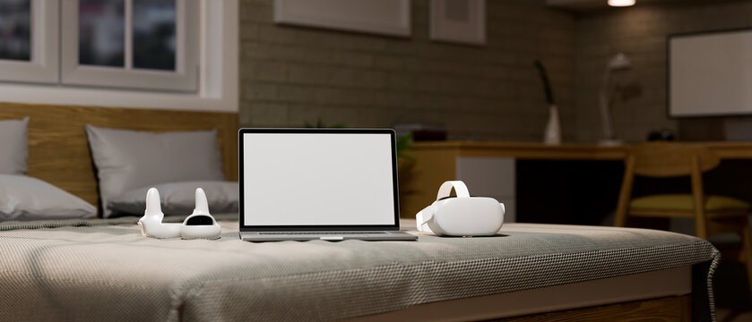 Bedroom Background With Modern Gadgets Concept, Laptop White Screen Mockup And VR Headset